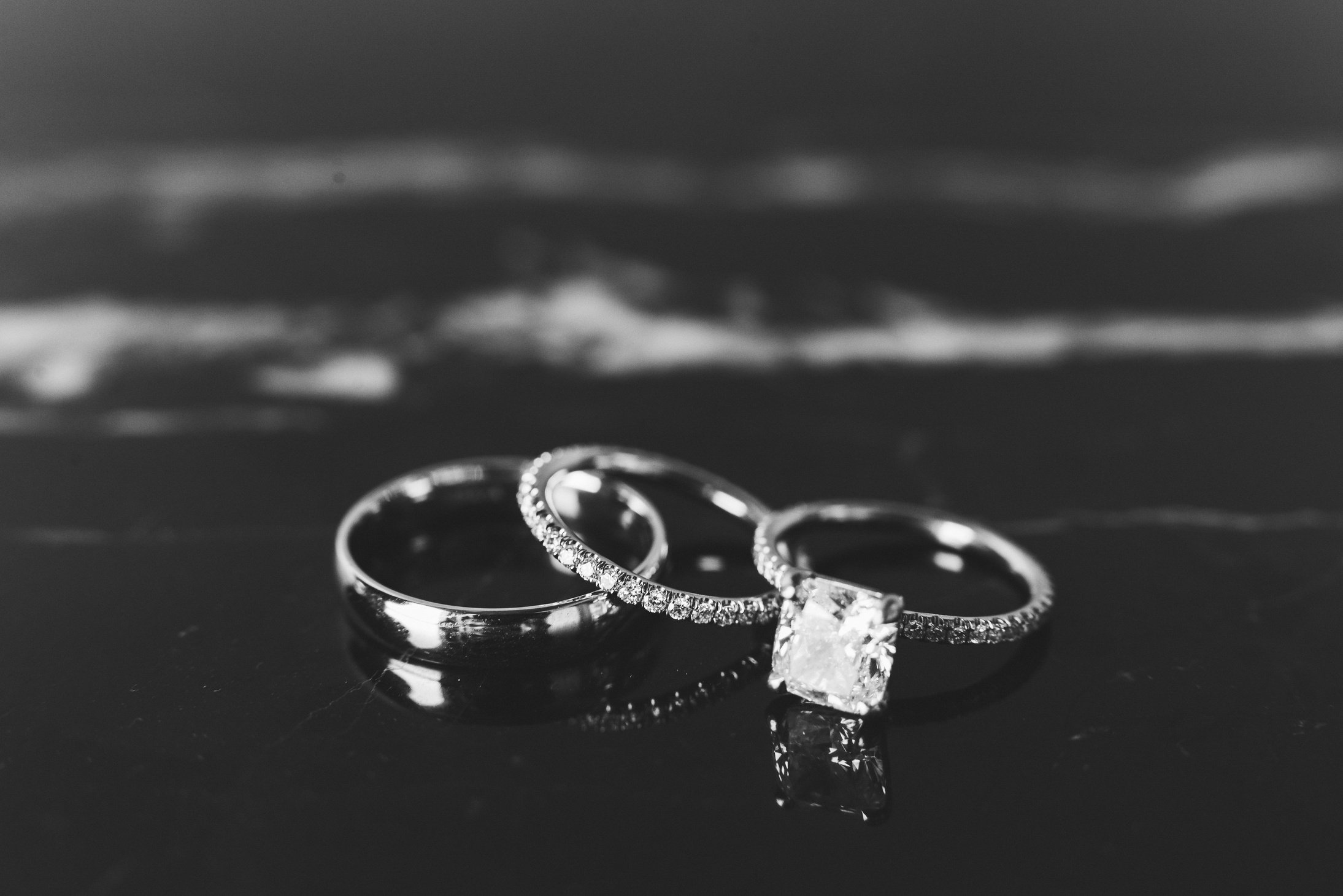 Gemstone Wedding and Engagement Rings on Black Marble Table